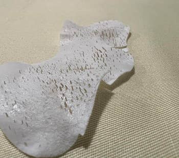 A reviewer photo of the pore strip full of dirt after using it