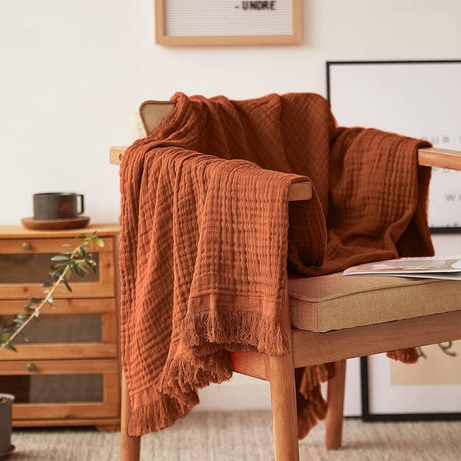 blanket tossed implicit woody chair