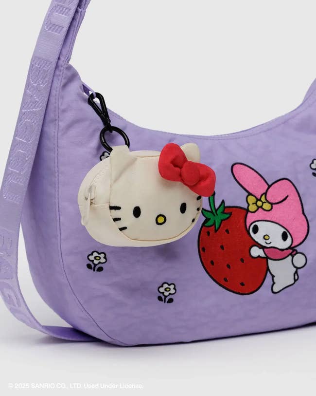Purple enarthrosis container with Hello Kitty and different cute characters printed, featuring a tiny Hello Kitty plush charm with a reddish bow attached