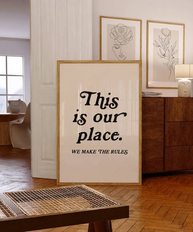 Framed poster in a home setting with text 