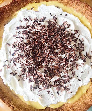 BuzzFeeder's photo of homemade banana cream pie with whipped cream and chocolate shavings