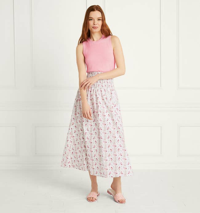 model in white and pink floral print skirt