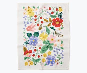 Close-up of tea towel design with various flowers and a butterfly