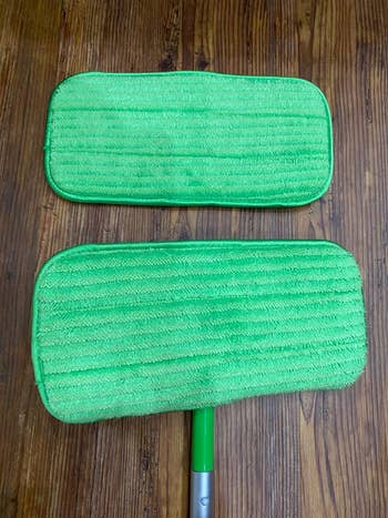 a reviewer showing the bottom of the pad attached to a swiffer