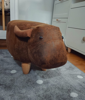 reviewer photo of the cow ottoman