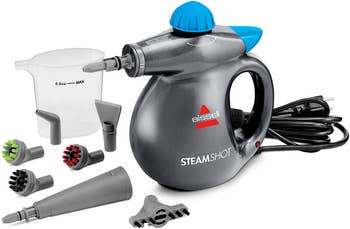 Silver handheld floor steamer with brush attachment and water tank 
