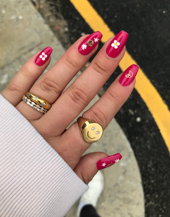 model wearing nail stickers on manicured nails