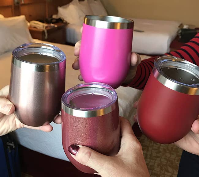 Reviewer image of four people holding the wine tumblers