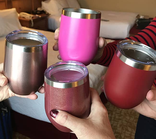 Reviewer image of four people holding the wine tumblers