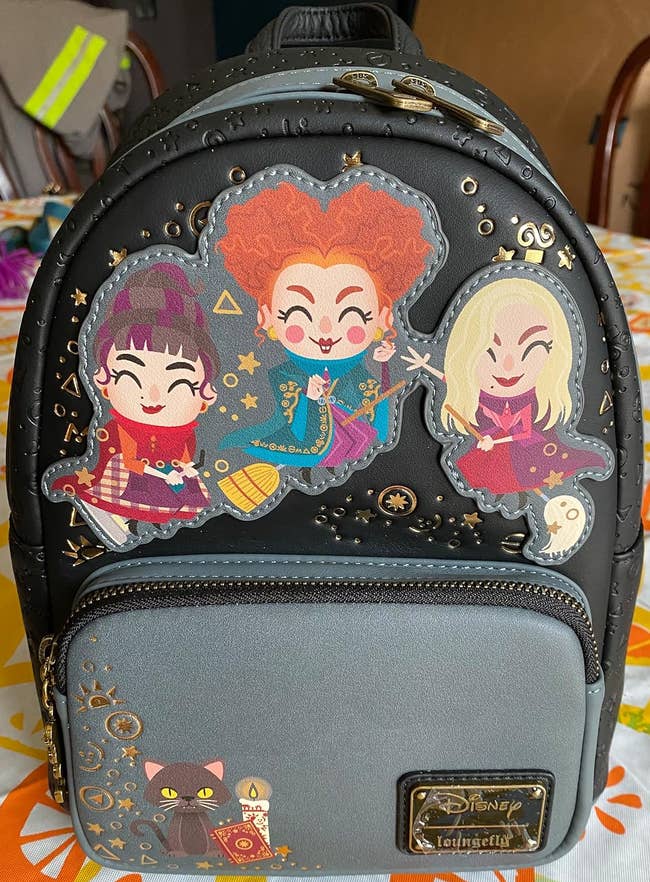 Backpack featuring cartoon witches from
