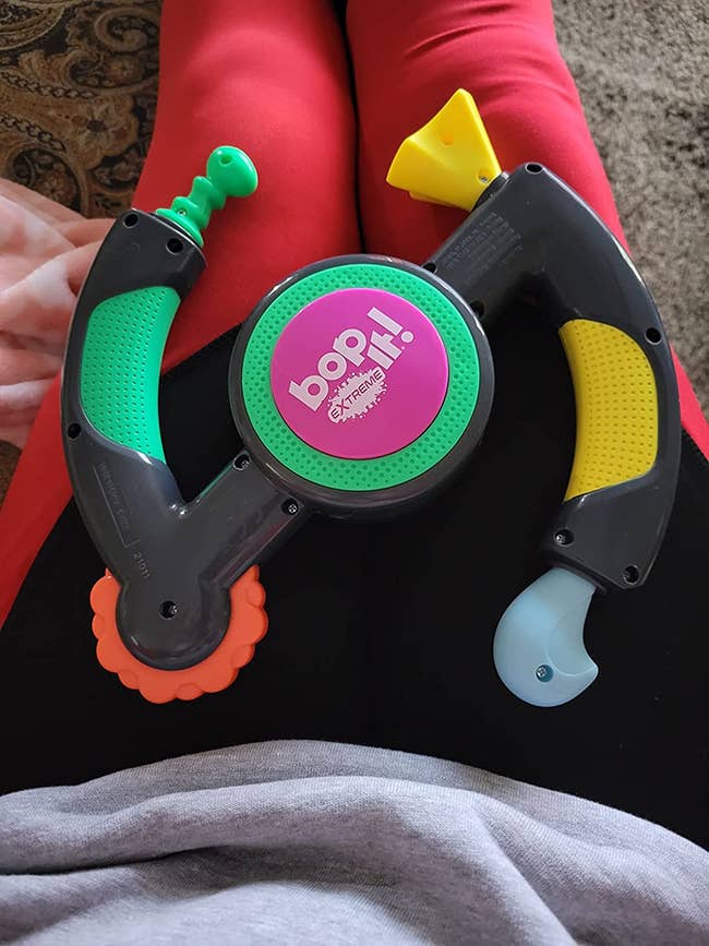reviewer's bop it on their lap