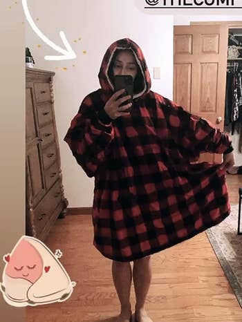 reviewer standing up wearing the black and red plaid comfy