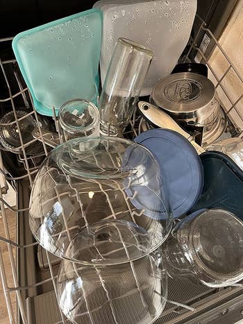 reviewer photo of dishes in a dishwasher looking sparkling clean with zero residue