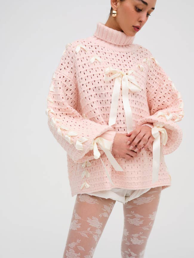 the sweater in light pink