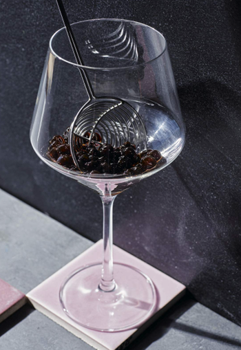 closeup of boozy boba in a wine glass