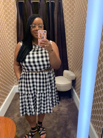 another reviewer wearing the dress with a belt and strappy sandals