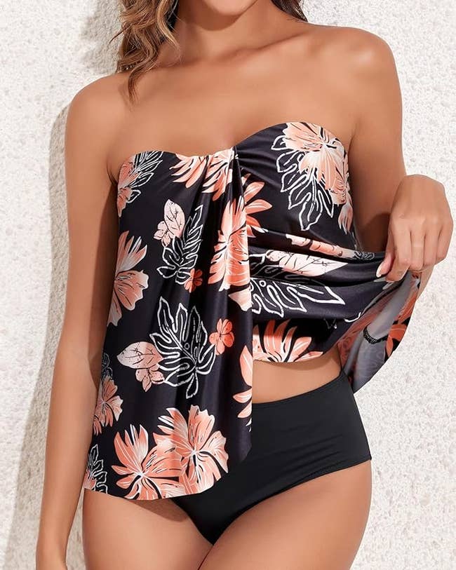 Woman in a black high-waisted bikini with a floral top for a shopping article