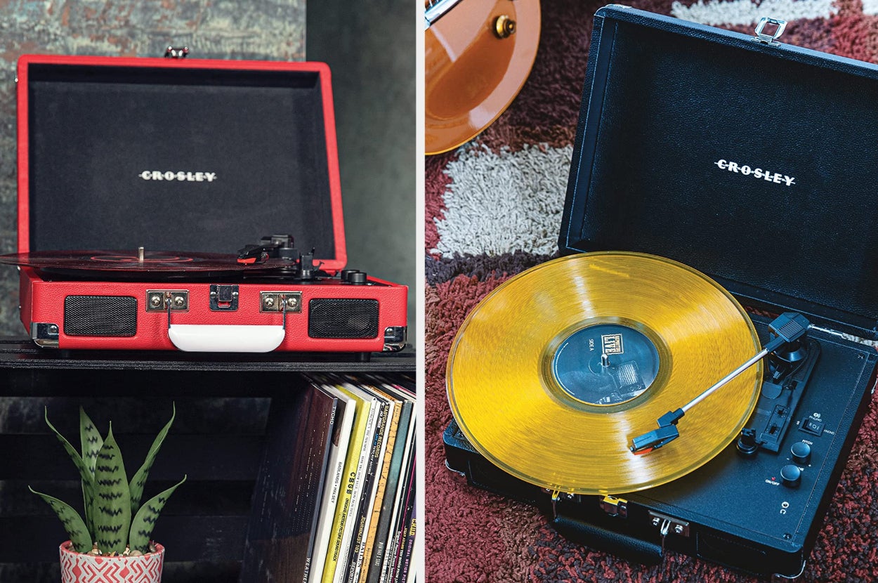Red suitcase turntable sitting on top of black bookshelf, interior view of product in black with two dials and black and silver stylus