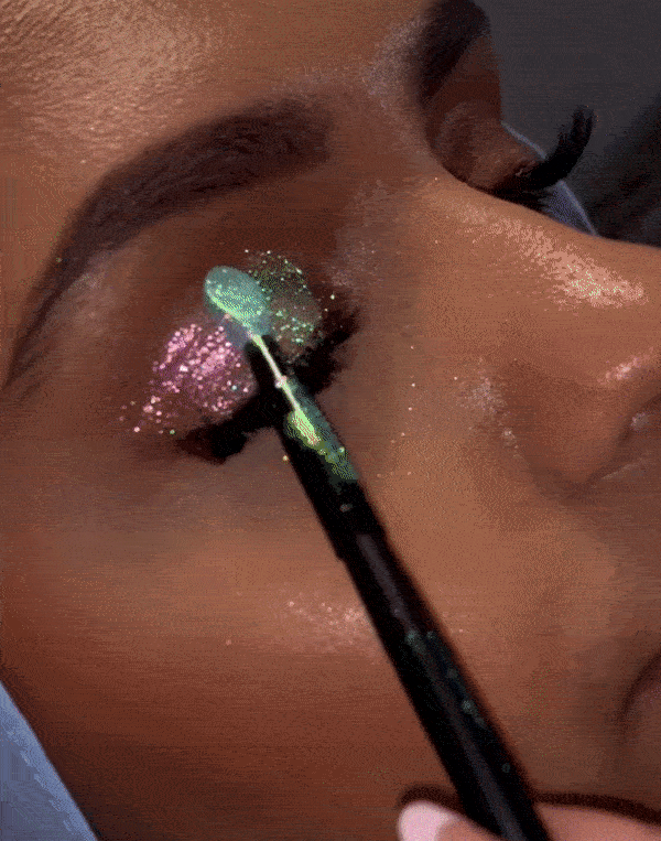 gif of a model applying sparkly pigment 