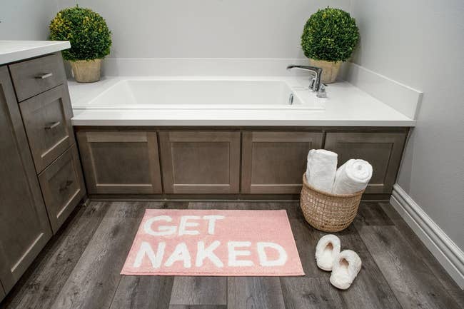 bath mat that says 