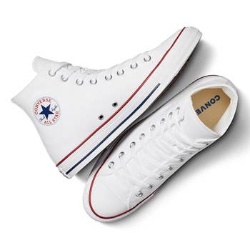 White high-top Converse sneakers with a classical  rubber sole, featuring the iconic All Star logo