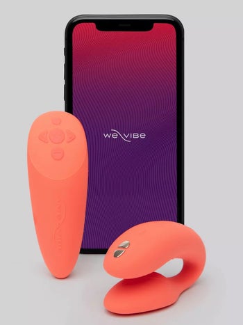 Orange vibrator and wireless remote next to phone