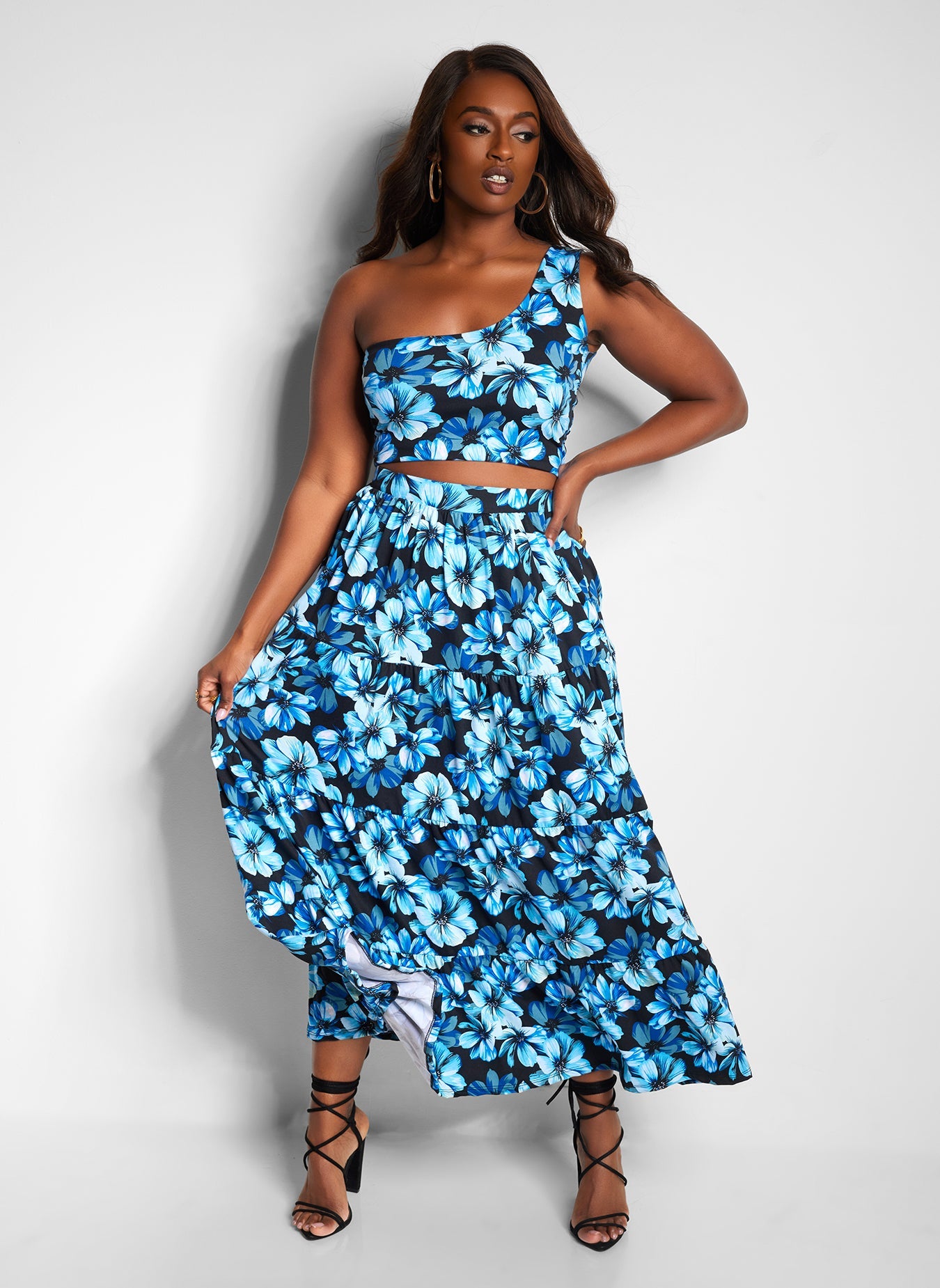 model in black and blue floral set