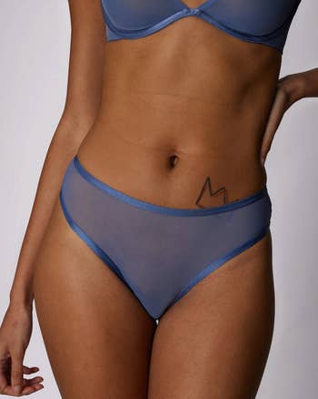 model wearing the solid blue underwear