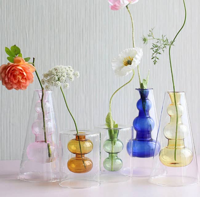 The bubble vases shown in different colors and sizes