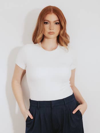 model wearing the bodysuit in white