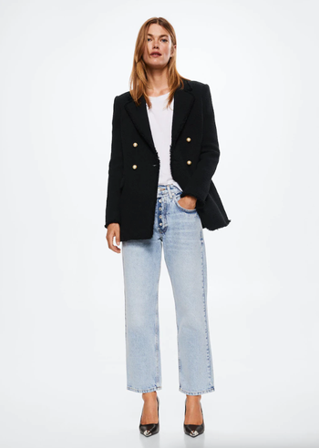 model in the black blazer with blue jeans and a white tee