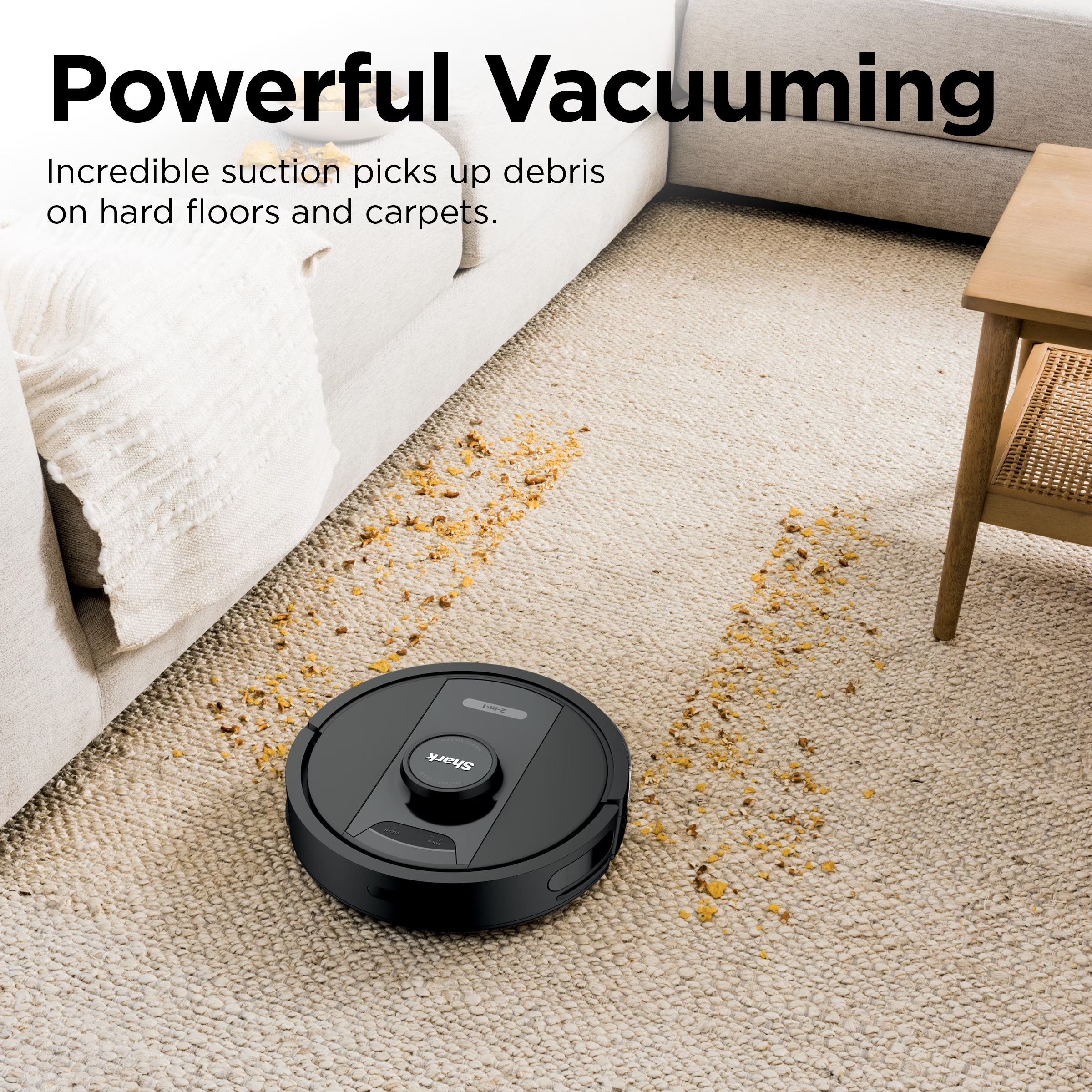 Robot vacuum cleaning a carpet with scattered debris, showcasing powerful suction and efficient performance on various floor types
