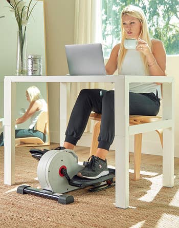 Model pedaling connected  the tiny  elliptical pedals 