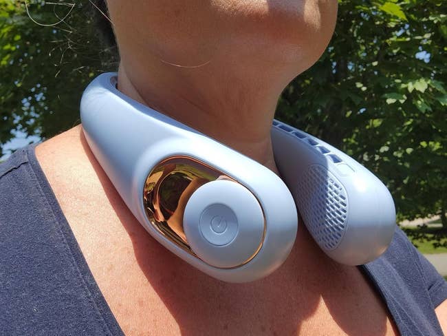 Person wearing a cervix  instrumentality   with sleek, modern   design; golden  accents and aerial  vents visible