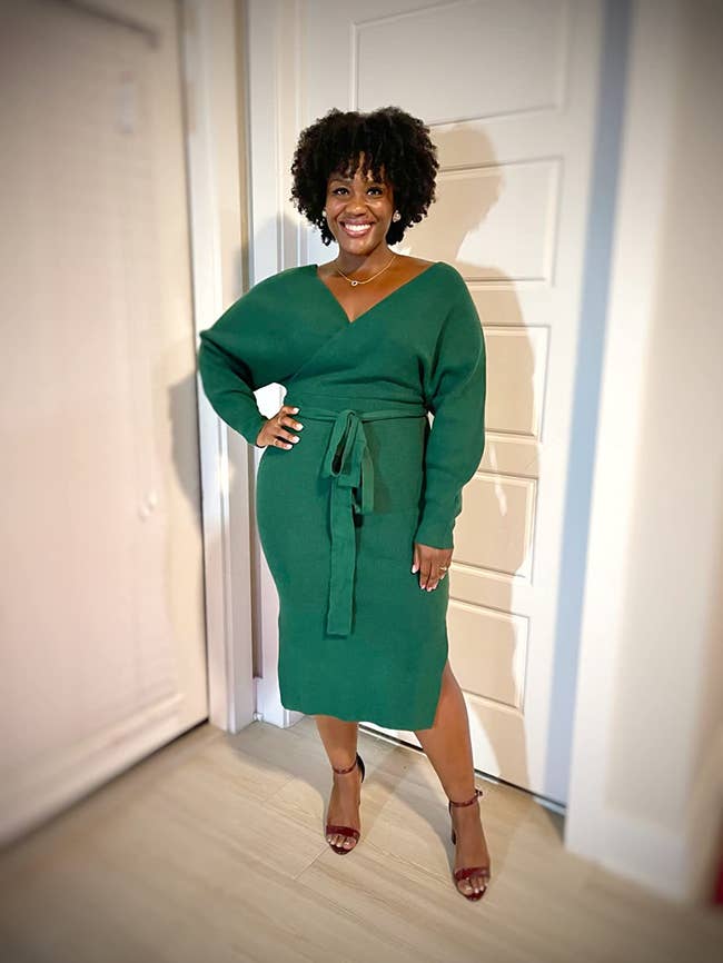 a reviewer wearing the dress in green