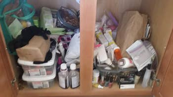 reviewer before photo showing a clutter of objects under their sink