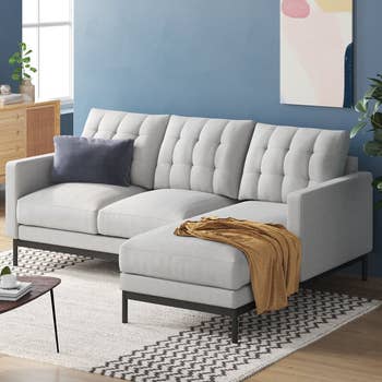 lifestyle photo of tufted white sectional sofa