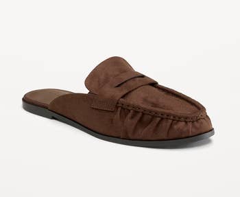 A brownish suede slip-on loafer with a rounded toe, designed for casual wear