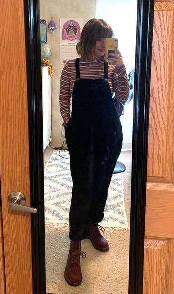 another reviewer wearing black overalls
