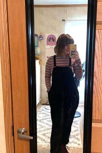 another reviewer wearing black overalls