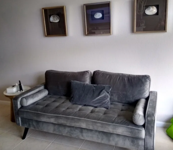 reviewer photo of the couch in gray in living room