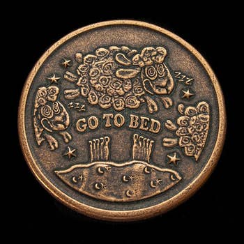 the other side of the same coin showing sheep and text reading 