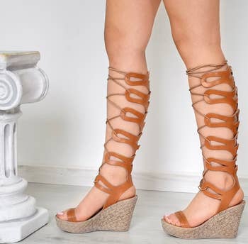 Model wearing the brown gladiator sandals 