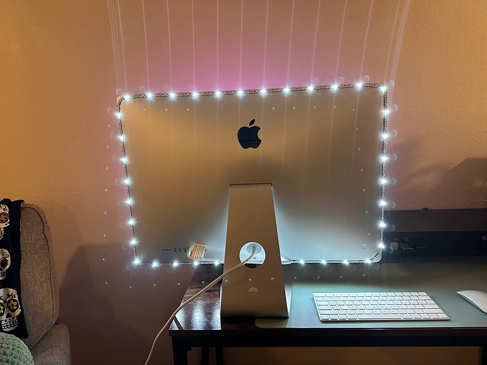 Reviewer showing the strip attached to back of iMAC