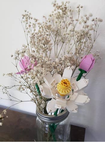 Bouquet of white and pink LEGO flowers in a mason jar, mixed with baby's breath