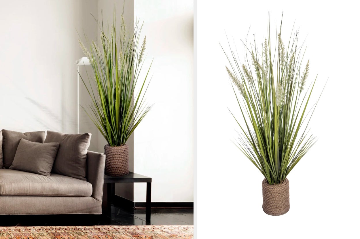 Green onion grass plant inside of brown rope pot on top of a black side table next to brown couch, product on white background