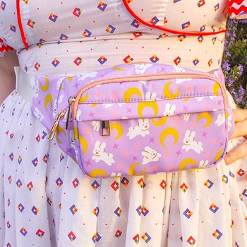 model wearing purple fanny pack with bunnies on it