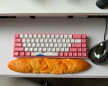 the bread wrist rest in front of a keyboard