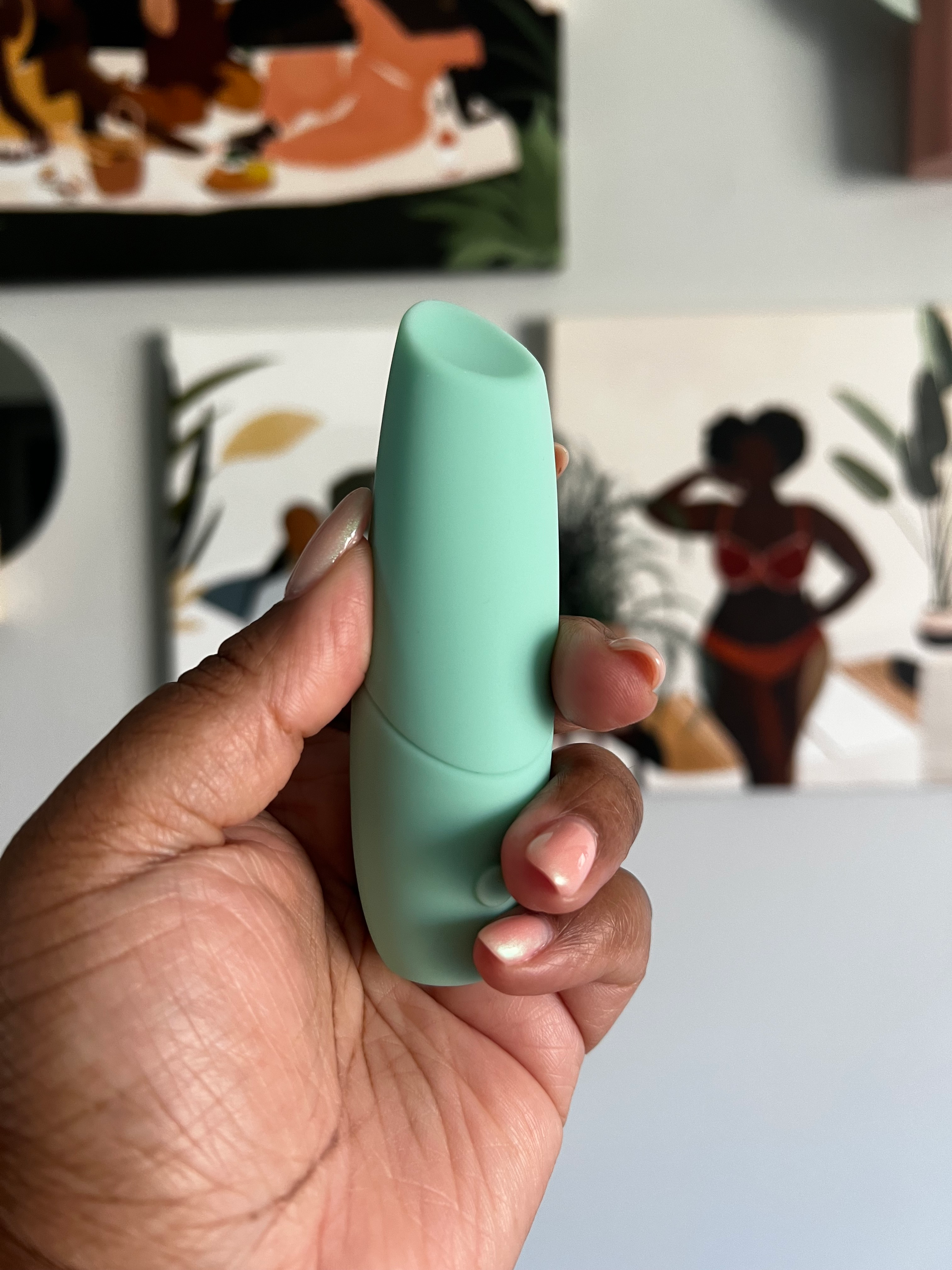 Hand holding mint greenish  slug  vibrator