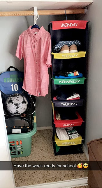 a reviewer photo of the organizer inside of a closet with a caption that reads have the week ready for school